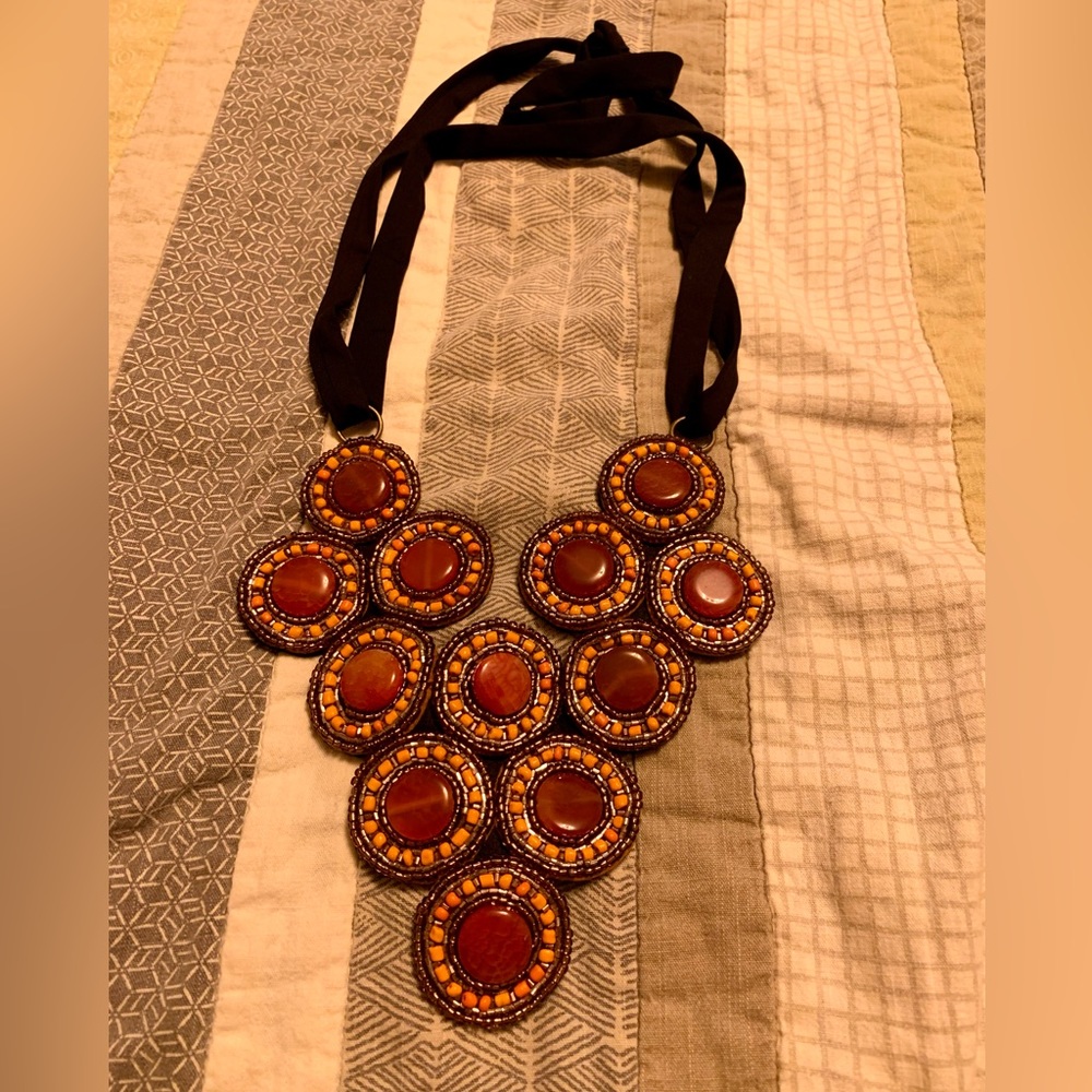 Beaded necklace with adjustable straps